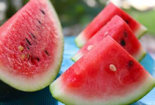 sliced watermelon on white table