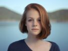 shallow focus photography of woman outdoor during day